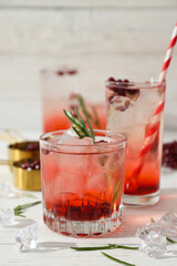Red cocktail with fresh pomegranate on a white background