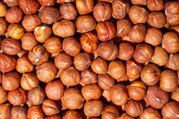 Scattered Peeled Hazelnut - Top View. Background from Hazelnuts. Natural High-Calorie Snacks