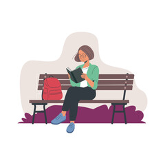 person sitting on a bench and reading a book