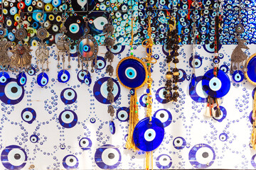 numerous distinct types of evil eyes displayed on the wall