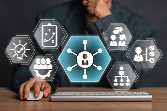 Business professional interacting with digital icons representing soft skills like communication, teamwork, and leadership.