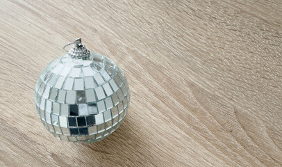 Shiny disco ball in snow, copy space