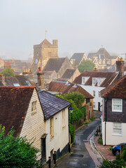 View towards St Thomas �ecket Church at foggy morning, Lewes, East Sussex, England, United Kingdom