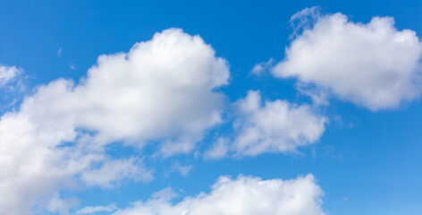 White clouds against a blue sky