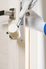 the master with a special rubber hammer adjusts the door for proper operation