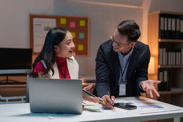 Team of Asian businessmen and women holding cell phones to contact customers Get business information to discuss financial document details. online marketing The concept of successful teamwork.