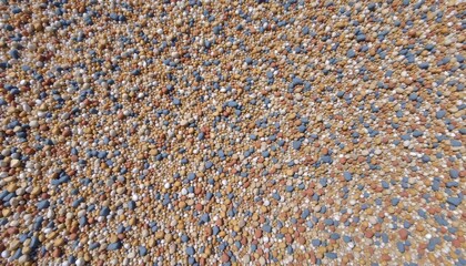 Fototapeta premium Vibrant mosaic of colorful pebbles on a surface
