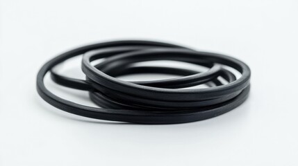 Naklejka premium Isolated black rubber band on white background