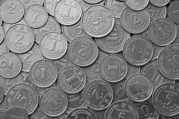 Ukrainian money, exchange coin, white coins of different denomination in random order.