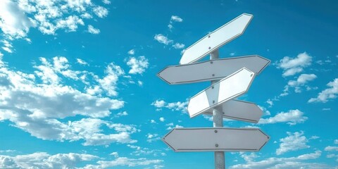 Blank Direction Signs Against Blue Sky