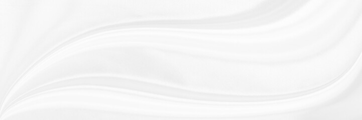 White gray satin texture that is white silver fabric silk panorama background with beautiful soft blur pattern natural.