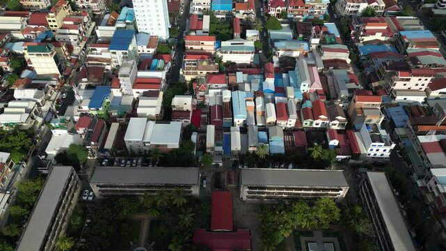 Toul sleng museum and surrounding urban area in phnom penh city during daylight, aerial view