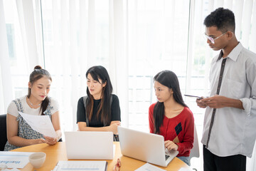 Business people group diverse colleagues team discuss project in  bright modern office Startup...