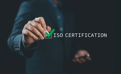 ISO certification approval concept. A person highlighting ISO certification process with a glowing...