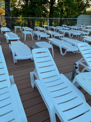 Deck chairs by an outdoor pool at a luxury resort