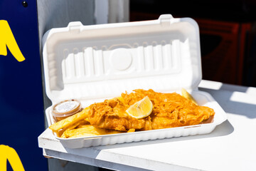 fish and chips in polystyrene takeaway box