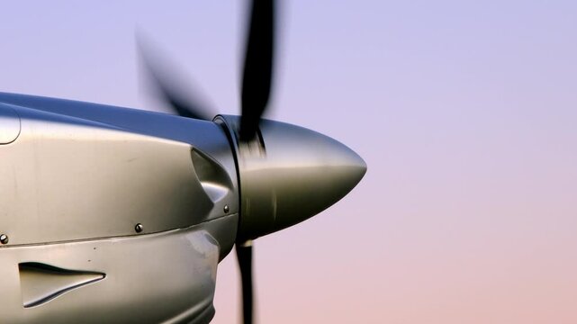 The propeller of a single-engine light aircraft spins and stops. Aircraft engine shutdown after flight