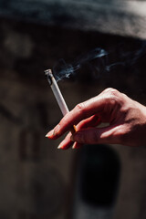 hand holding cigarette