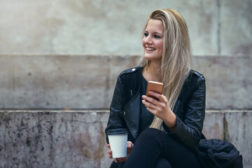 Thinking, coffee or happy woman in city with phone on social media or blog for fashion tips....