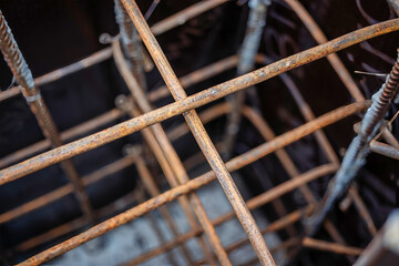 Construction work on a reinforced concrete foundation highlighting the rebar structure at a...