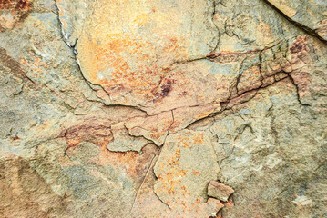 Rock and crag background. Stone texture. Texture of light brown crag
