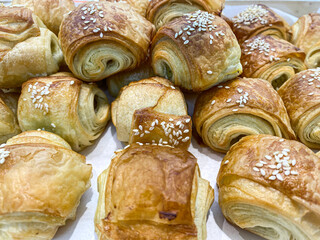 a close up shot of a tray of freshly baked chocolate croissant.