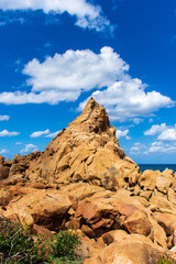 Low-angle view of rock formation against the sky.