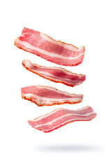 Crispy fried bacon slices falling down on white background