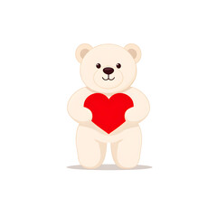 Obraz premium A teddy bear is holding a red heart isolated on white