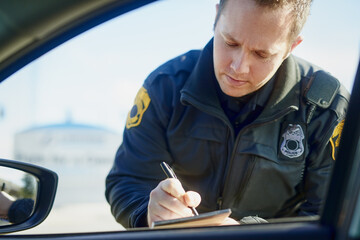 Writing, policeman and traffic stop with ticket for checkpoint, security and crime investigation on...