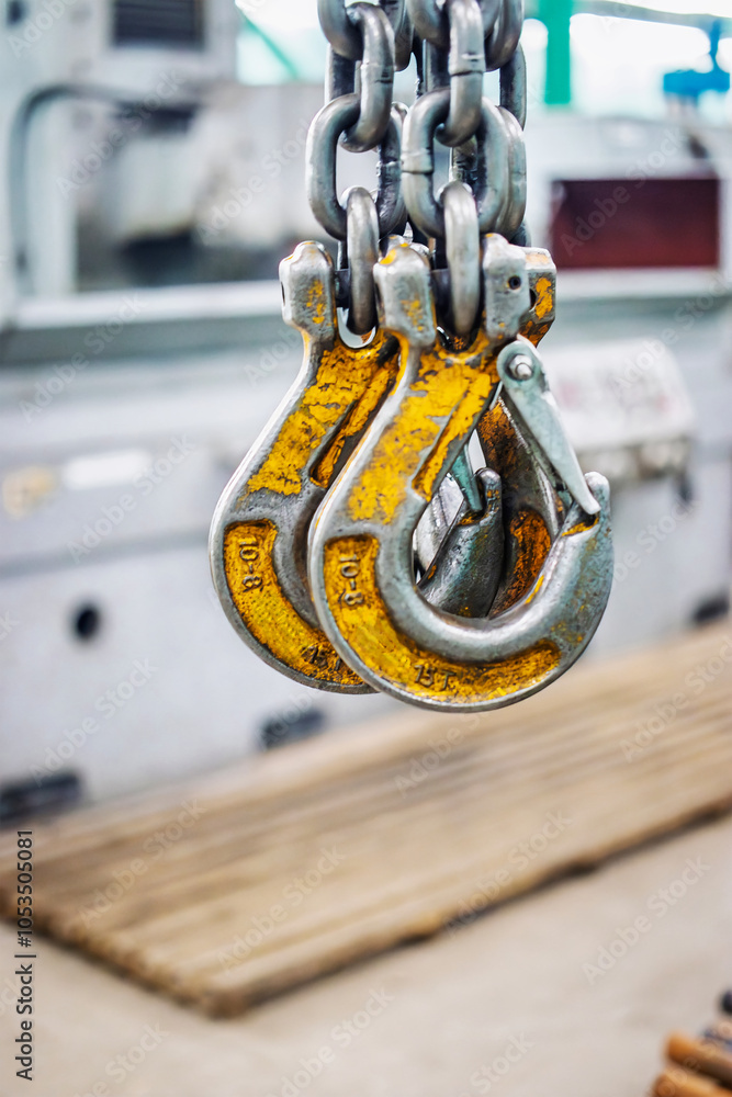 Poster heavy-duty lifting device in an industrial workshop designed for moving heavy loads efficiently and 