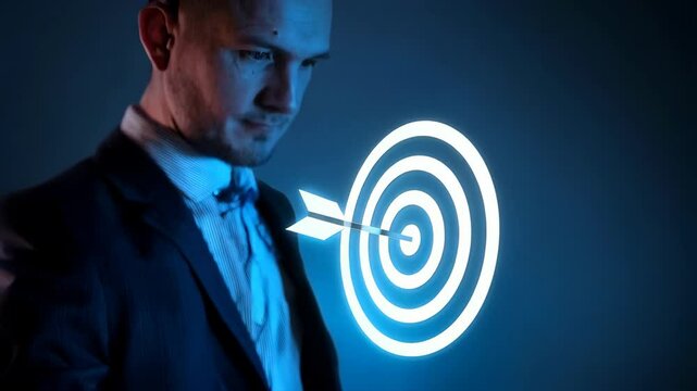 A business professional presents a digital target with an arrow, symbolizing goals and success.