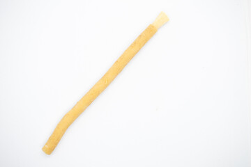 old traditional islamic natural toothbrush miswak or siwak, on white background