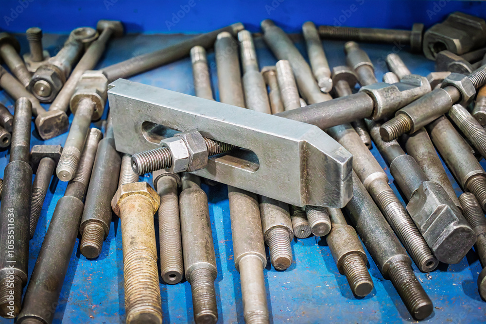 Poster various tools for turning work displayed on a blue workbench in a workshop, showcasing multiple size