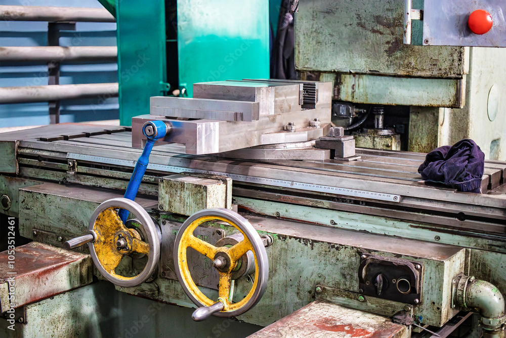 Poster a close-up view of an industrial milling machine in an active workshop showing precision machining p