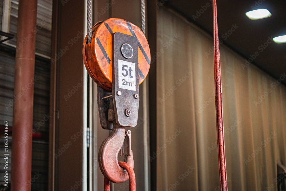 Poster heavy-duty lifting device used in industrial workshops for moving large items efficiently and safely