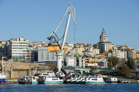 ISTANBUL, TURKEY - OCTOBER 1, 2024: View from the historic Golden Horn Shipyard (Halic Tersanesi in Turkish) with vessels in process, cranes and heavy industry equipment.