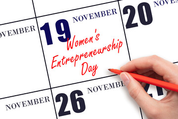 November 19. Hand writing text Women's Entrepreneurship Day on calendar date. Save the date.
