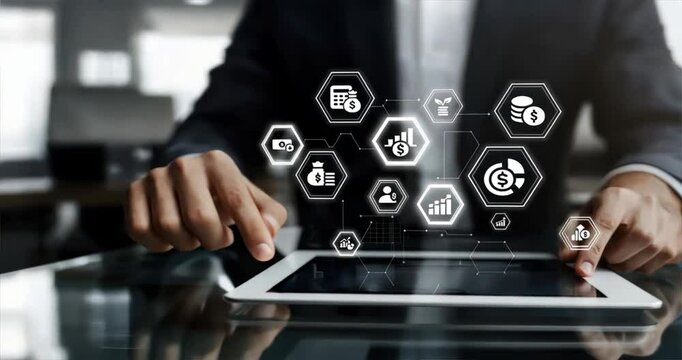 Businessman with tablet digital icons and hexagons representing business technology and innovation, financial literacy, budgeting workshops, financial coaching