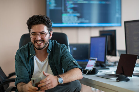 A programmer diligently testing smartphone applications 