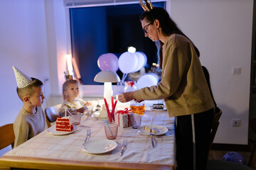 Family celebrating a birthday at home. Birthday party