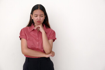 A young woman pouted, resting one hand under her chin