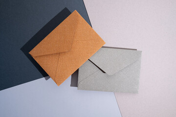 Paper envelopes on a light background. New mail, write a message. Send and receive mail. Postal...