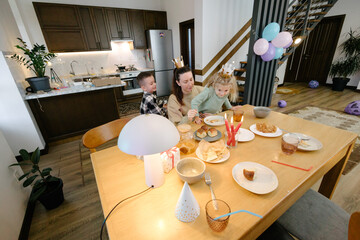Family having a birthday party at home