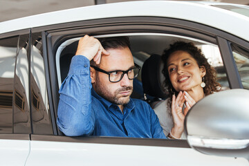 Naklejka premium Couple in Car Having a Discussion with Mixed Emotions