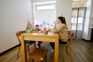 Family having a birthday party at home