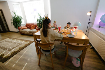 Family having a birthday party at home