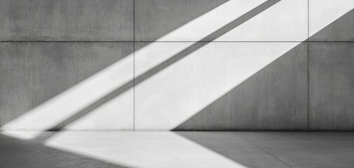 Abstract concrete wall with dynamic shadows creating a play of light and texture on a minimalist interior space, ideal for modern design themes.