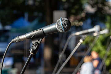 Microphone on stage outside in sunny weather