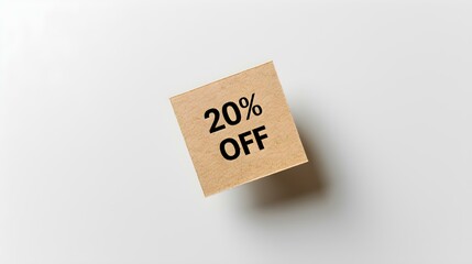 Black '20% OFF' Text on a Light Brown Square Paper Note. White Background with Copy Space
